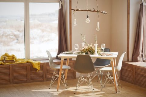 Dining table with chairs and a hanging lamp