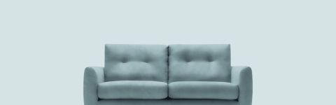 Plush green fabric triple seater sofa