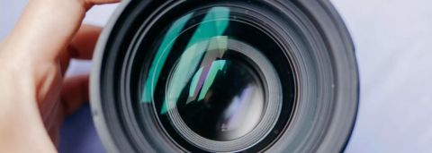 high-angle-shot-person-holding-camera-lens.jpg